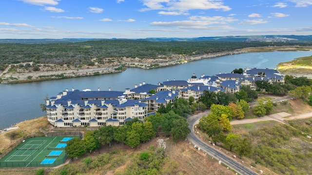 birds eye view of property with a water view