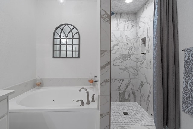 3404 American Dr Unit 2108, Lago Vista, TX 78645 - full bathroom featuring a shower stall, a tub with jets, and vanity
