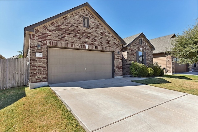 view of front of property featuring a front lawn and a garage