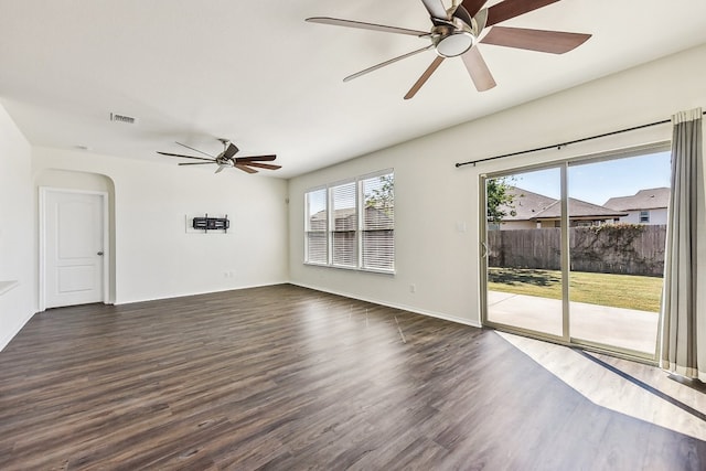 unfurnished room featuring ceiling fan and dark hardwood / wood-style flooring