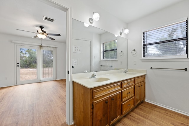 bathroom with vanity, ceiling fan, and wood-type flooring