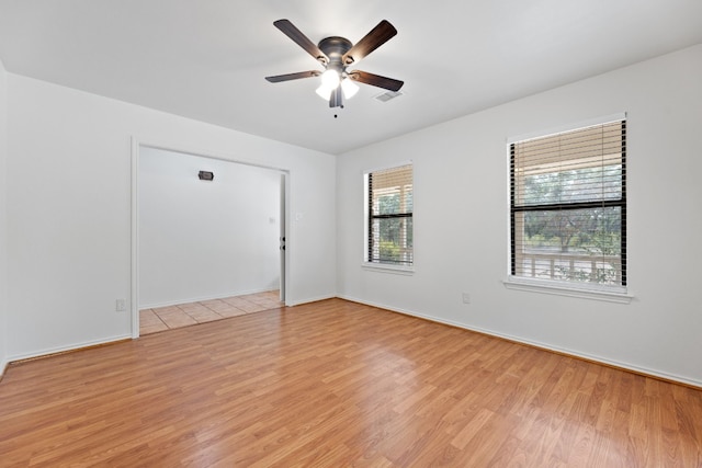 unfurnished room featuring light hardwood / wood-style floors and ceiling fan