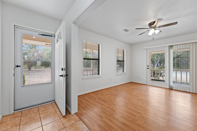 entrance foyer with light wood-type flooring and ceiling fan