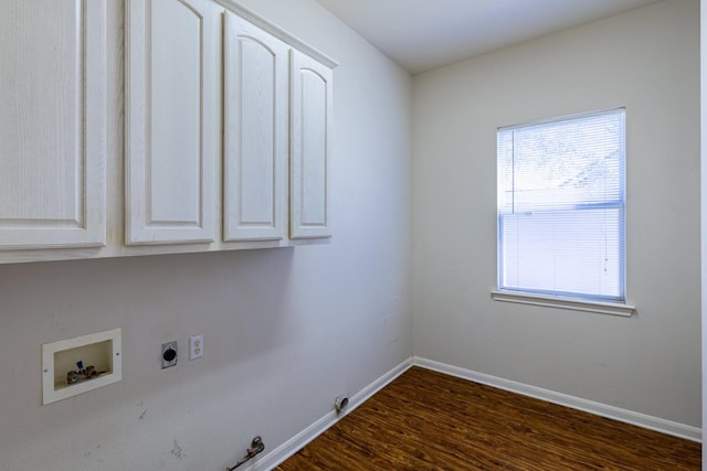 laundry room featuring cabinets, washer hookup, gas dryer hookup, dark wood-type flooring, and hookup for an electric dryer