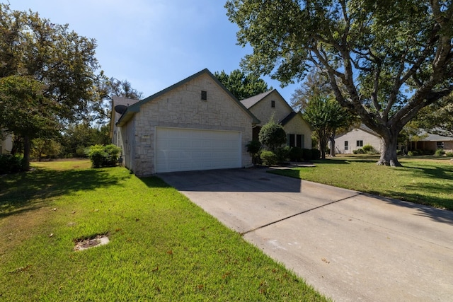 view of front facade with a front yard and a garage