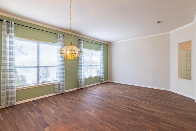 unfurnished dining area featuring crown molding, dark hardwood / wood-style flooring, and an inviting chandelier