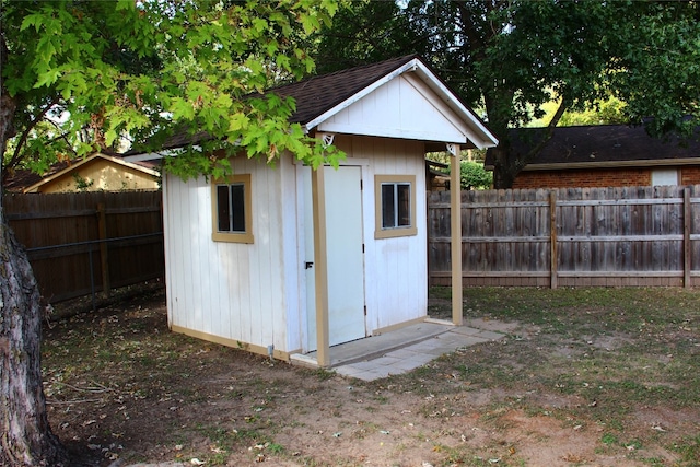 view of shed featuring a fenced backyard