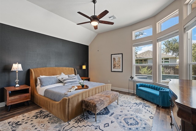 bedroom with wood-type flooring, vaulted ceiling, and ceiling fan