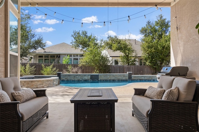 view of pool with a patio and an in ground hot tub