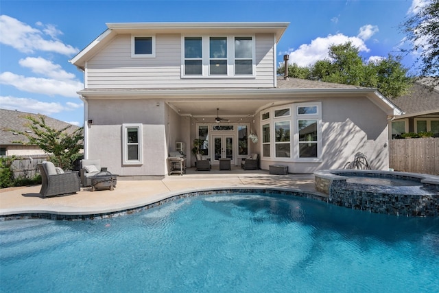 back of house featuring a patio, french doors, a swimming pool with hot tub, and ceiling fan