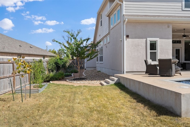 view of yard featuring outdoor lounge area, a patio, and ceiling fan