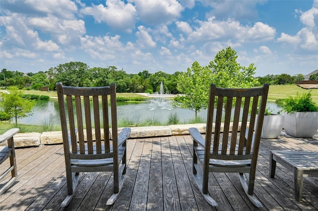 wooden deck featuring a water view