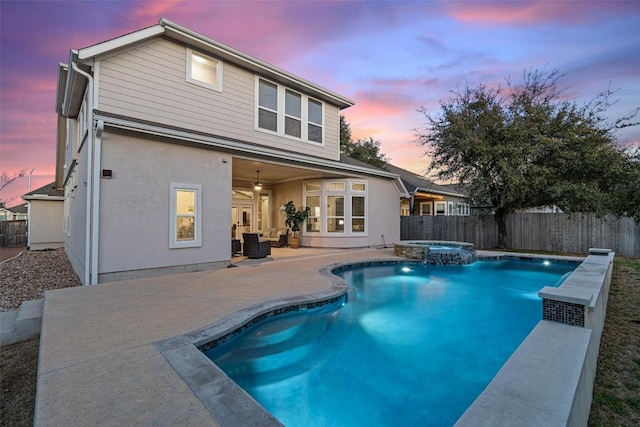 925 Overstreet Ln, Leander, TX 78641 - back of property featuring a fenced backyard, a patio, a pool with connected hot tub, and ceiling fan