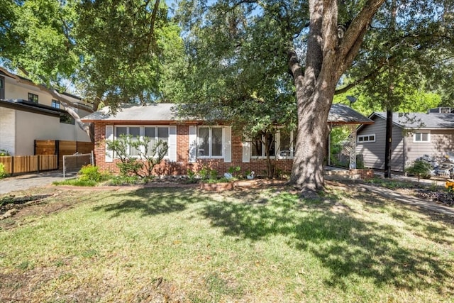 ranch-style house with a front lawn