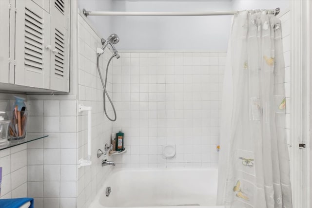 bathroom with shower / bath combination with curtain