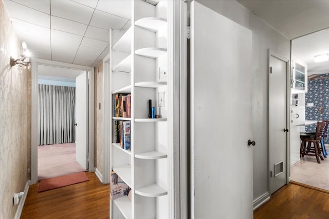 corridor with dark wood-type flooring