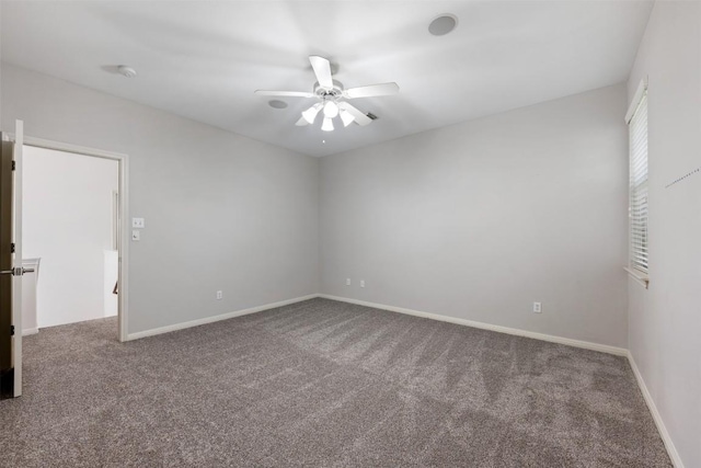 carpeted empty room featuring ceiling fan