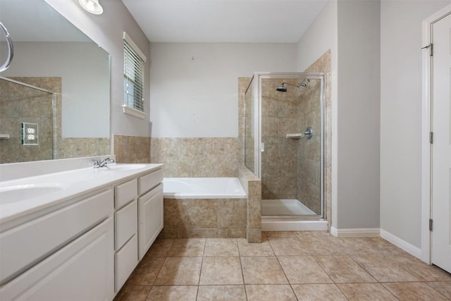 bathroom with tile patterned floors, plus walk in shower, and vanity