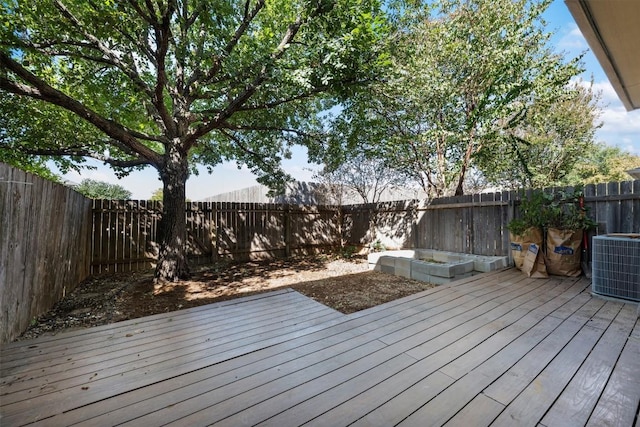 wooden deck with central AC unit