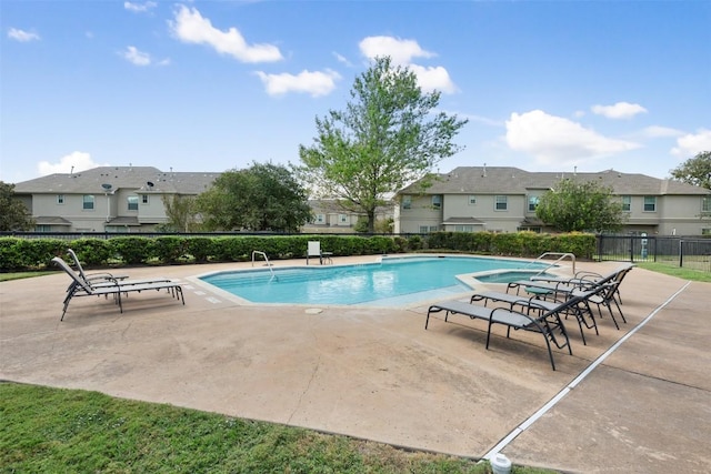 view of swimming pool featuring a patio area