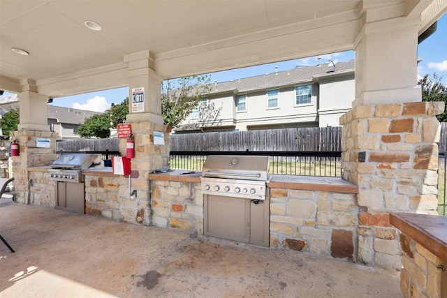 view of patio / terrace featuring exterior kitchen and area for grilling