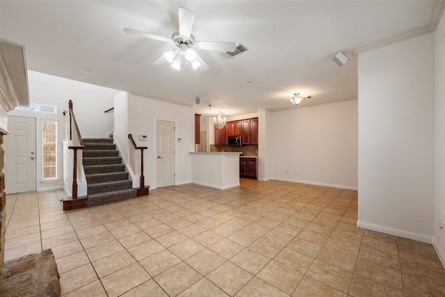 unfurnished living room with light tile patterned flooring, crown molding, and ceiling fan