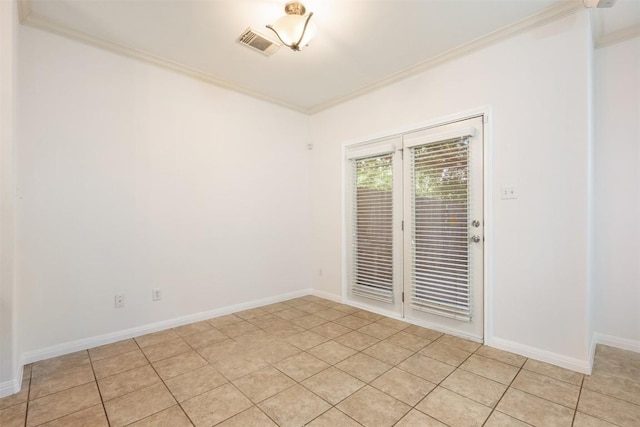 unfurnished room with crown molding and light tile patterned floors