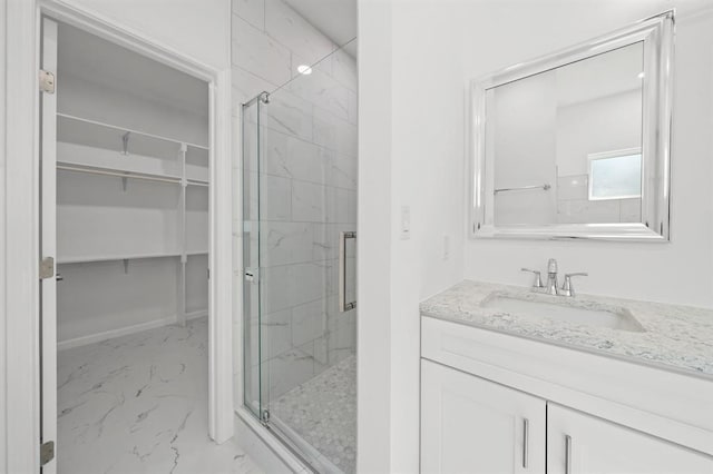 bathroom featuring vanity and walk in shower