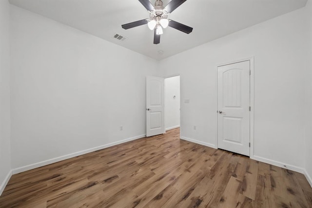 unfurnished bedroom with wood-type flooring and ceiling fan