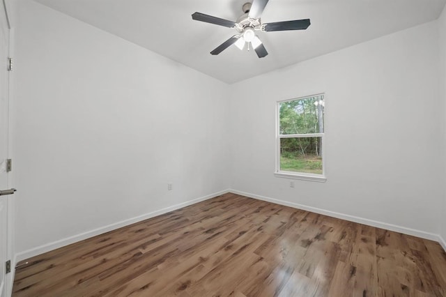 spare room featuring ceiling fan and wood-type flooring