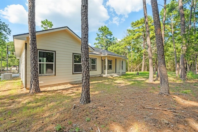 rear view of house with central AC