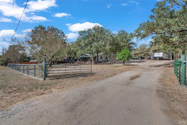 320 Pope Bnd S, Cedar Creek, TX 78612 - view of dirt / gravel driveway with a gated entry