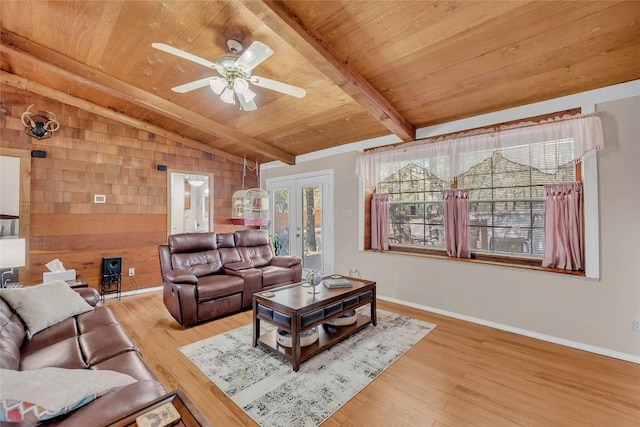 320 Pope Bnd S, Cedar Creek, TX 78612 - living room with wood ceiling, wood walls, a ceiling fan, wood finished floors, and french doors