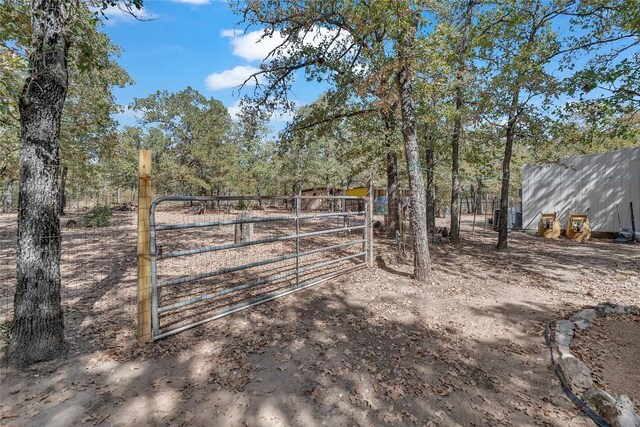 view of yard featuring a gate and fence