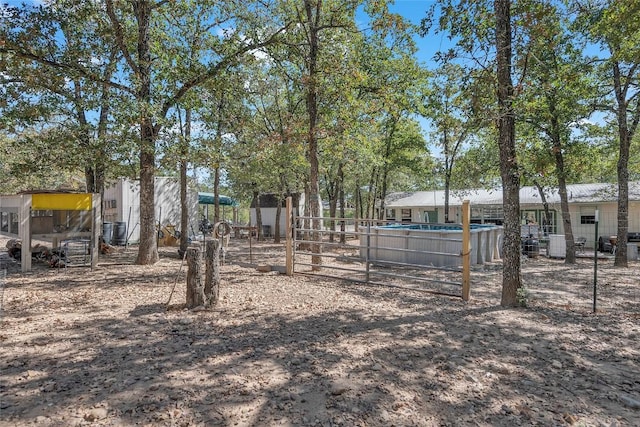 320 Pope Bnd S, Cedar Creek, TX 78612 - view of yard with an outdoor pool