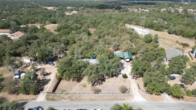 birds eye view of property with a wooded view