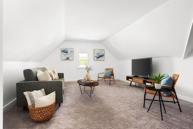 interior space featuring carpet flooring and lofted ceiling