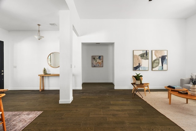 corridor featuring dark hardwood / wood-style flooring