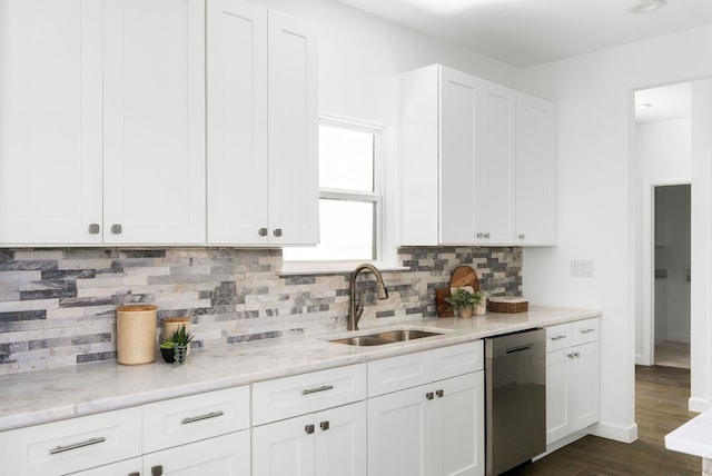 kitchen featuring white cabinets, dark hardwood / wood-style flooring, light stone countertops, dishwasher, and sink