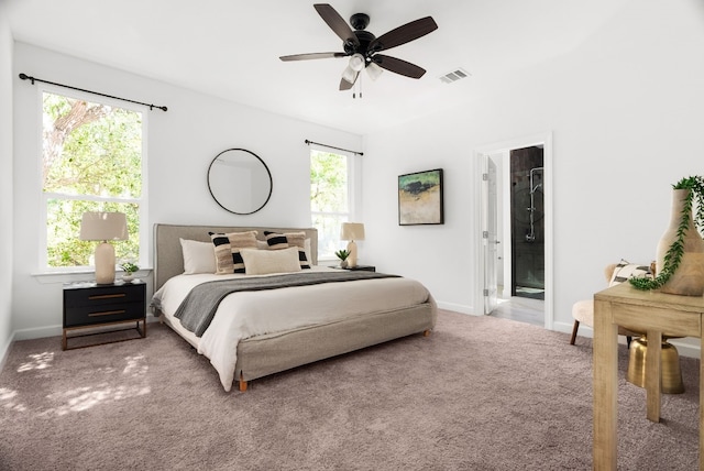 bedroom with connected bathroom, carpet, and ceiling fan