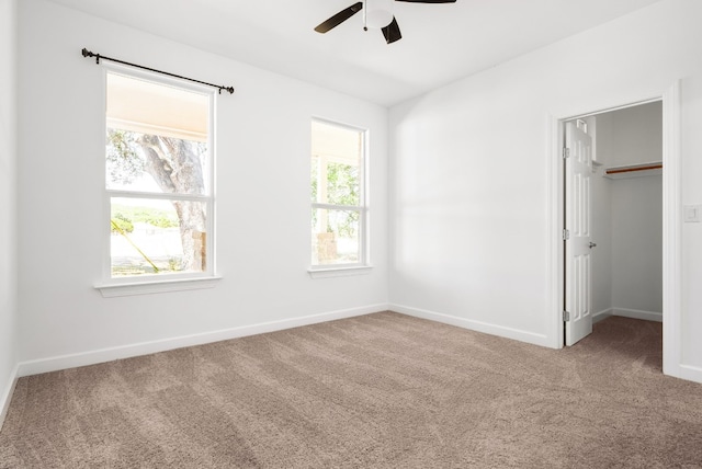 unfurnished bedroom with a closet, ceiling fan, and carpet flooring