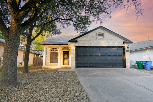 ranch-style home with a garage