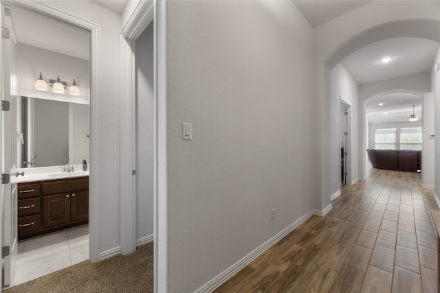 corridor with wood-type flooring