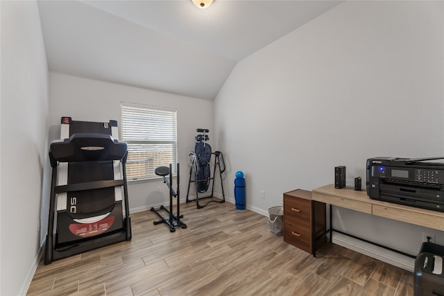 office area featuring hardwood / wood-style floors and vaulted ceiling