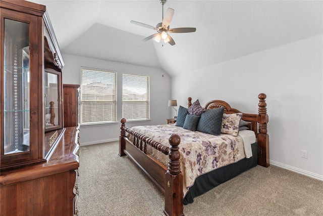 carpeted bedroom with ceiling fan and lofted ceiling