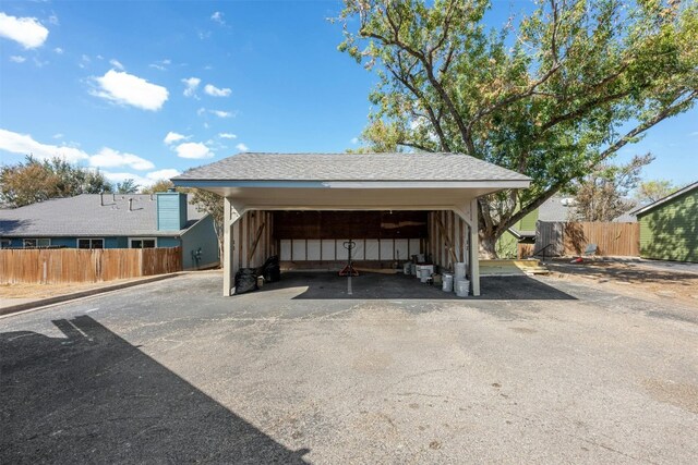 view of vehicle parking featuring a carport