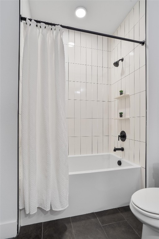 bathroom with tile patterned flooring, toilet, and shower / tub combo