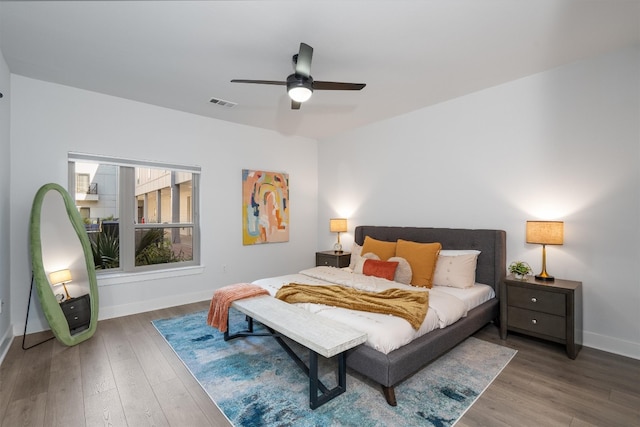 bedroom with ceiling fan and wood-type flooring