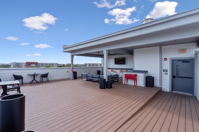 wooden terrace with an outdoor hangout area