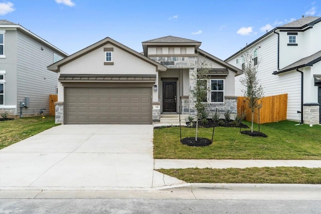 view of front of property with a front yard and a garage